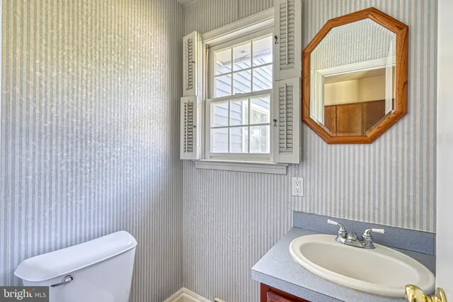 a view of an empty room with closet area