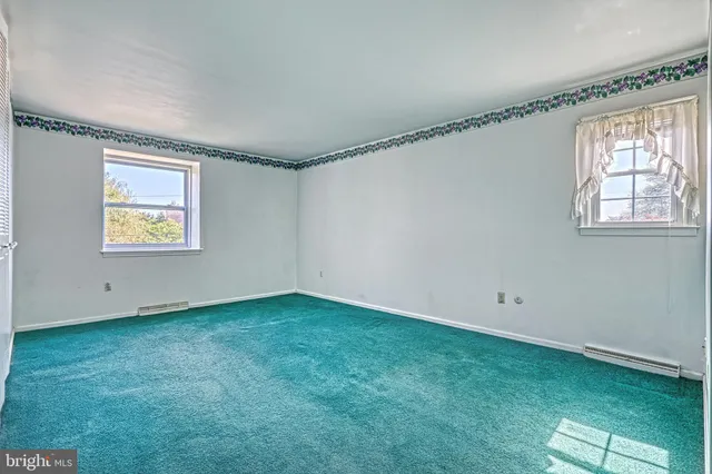 an empty room with windows