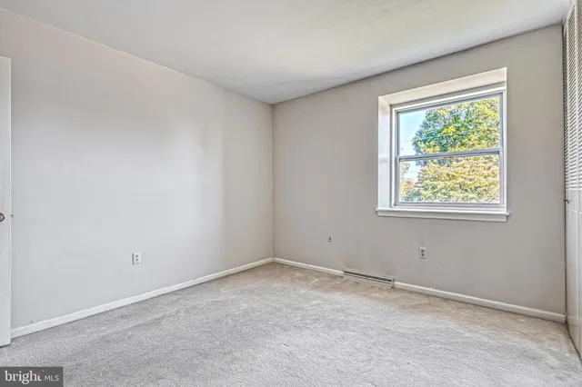 a view of a room with wooden walls