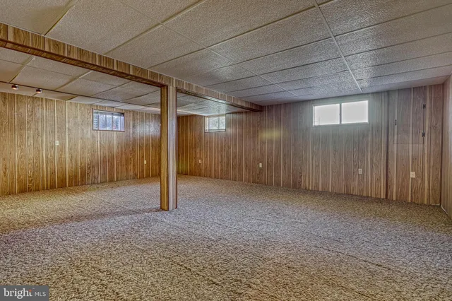 a view of an empty room with windows