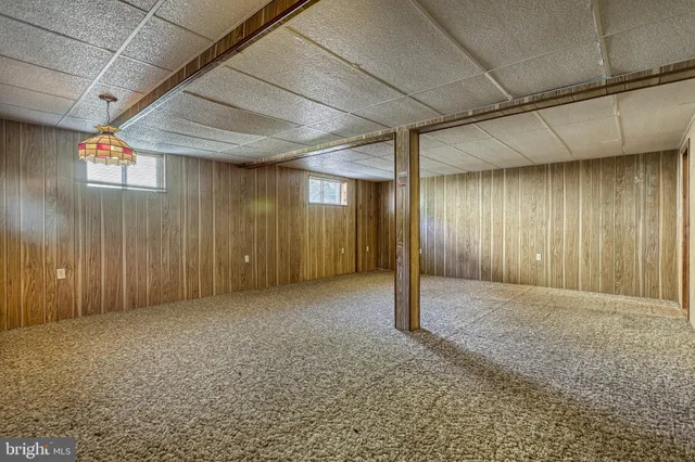 a aerial view of a house with swimming pool and a yard