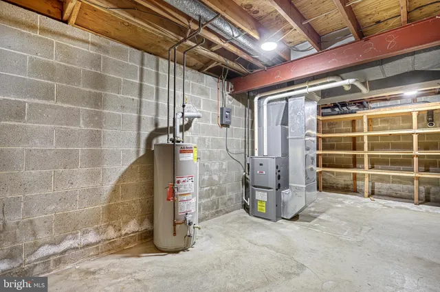 an aerial view of a house with pool outdoor seating and yard