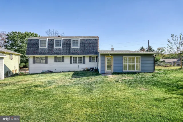 an aerial view of multiple houses with yard