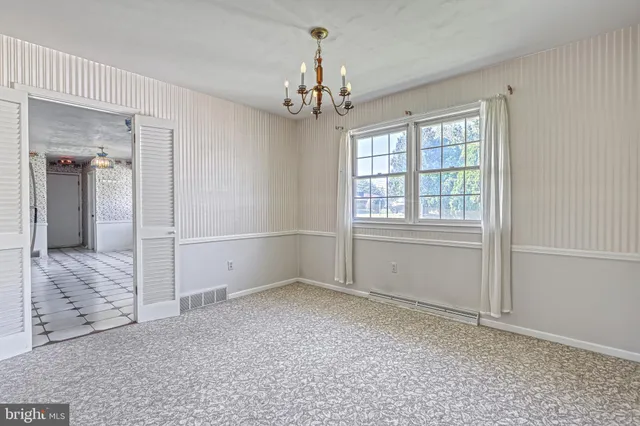 a white refrigerator freezer and a wooden floor