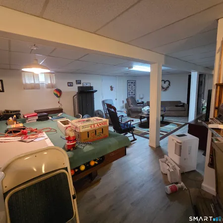 a bedroom with furniture and a wooden floor