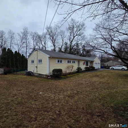 a view of a house with a back yard