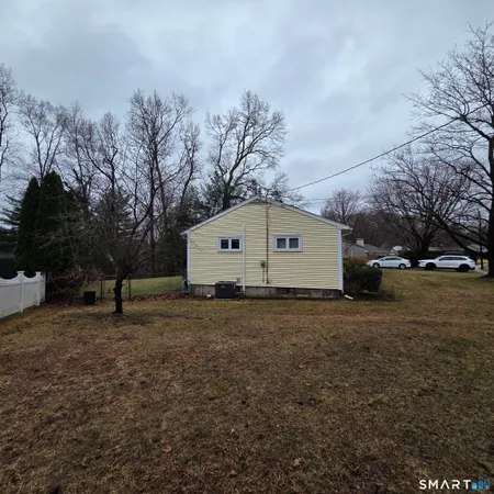a house with trees in the background