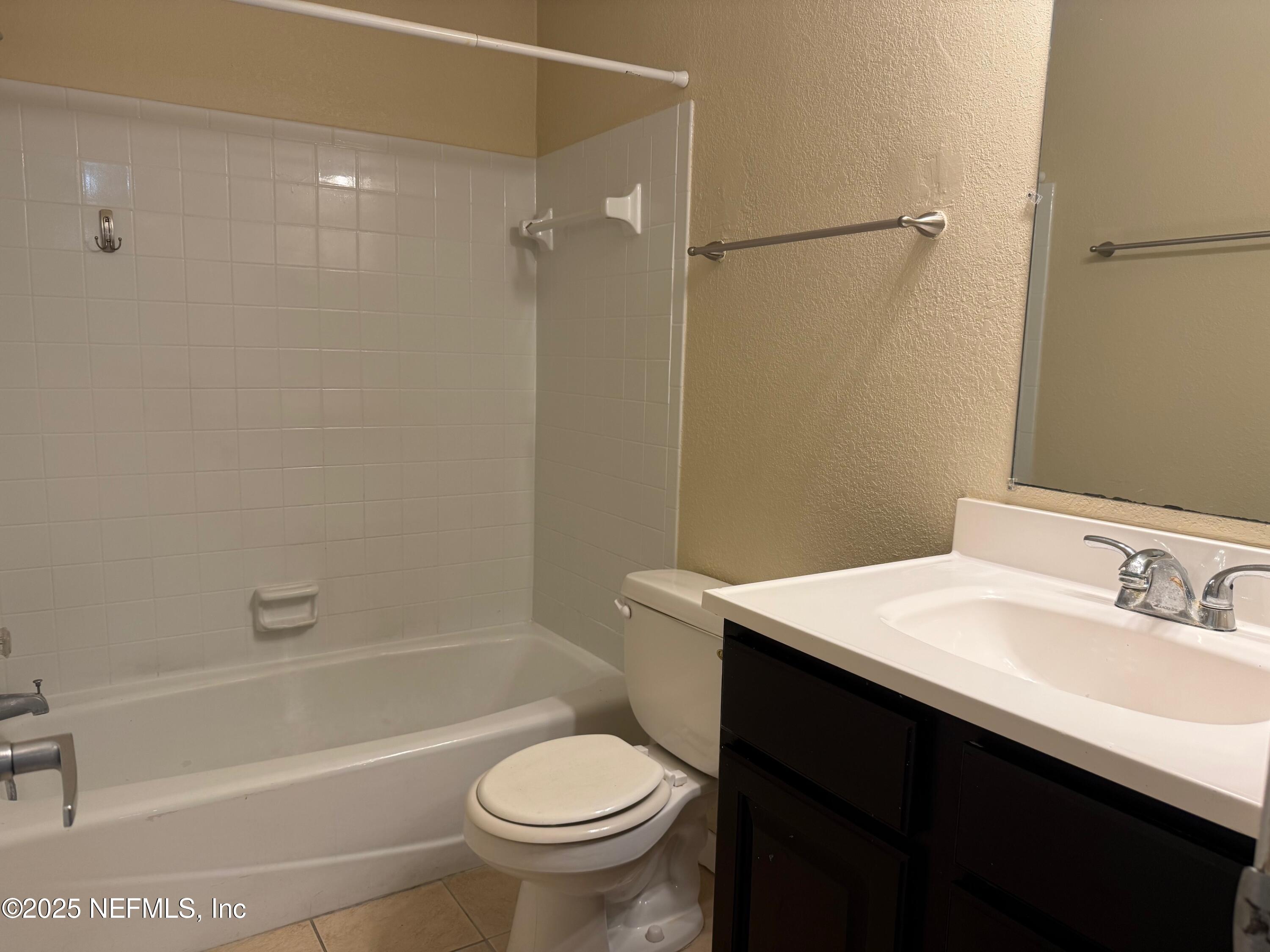 8880 Old Kings Road South, Unit 6 Jacksonville, FL 32257 - Photo 18 of 27 a bathroom with a sink a toilet and shower