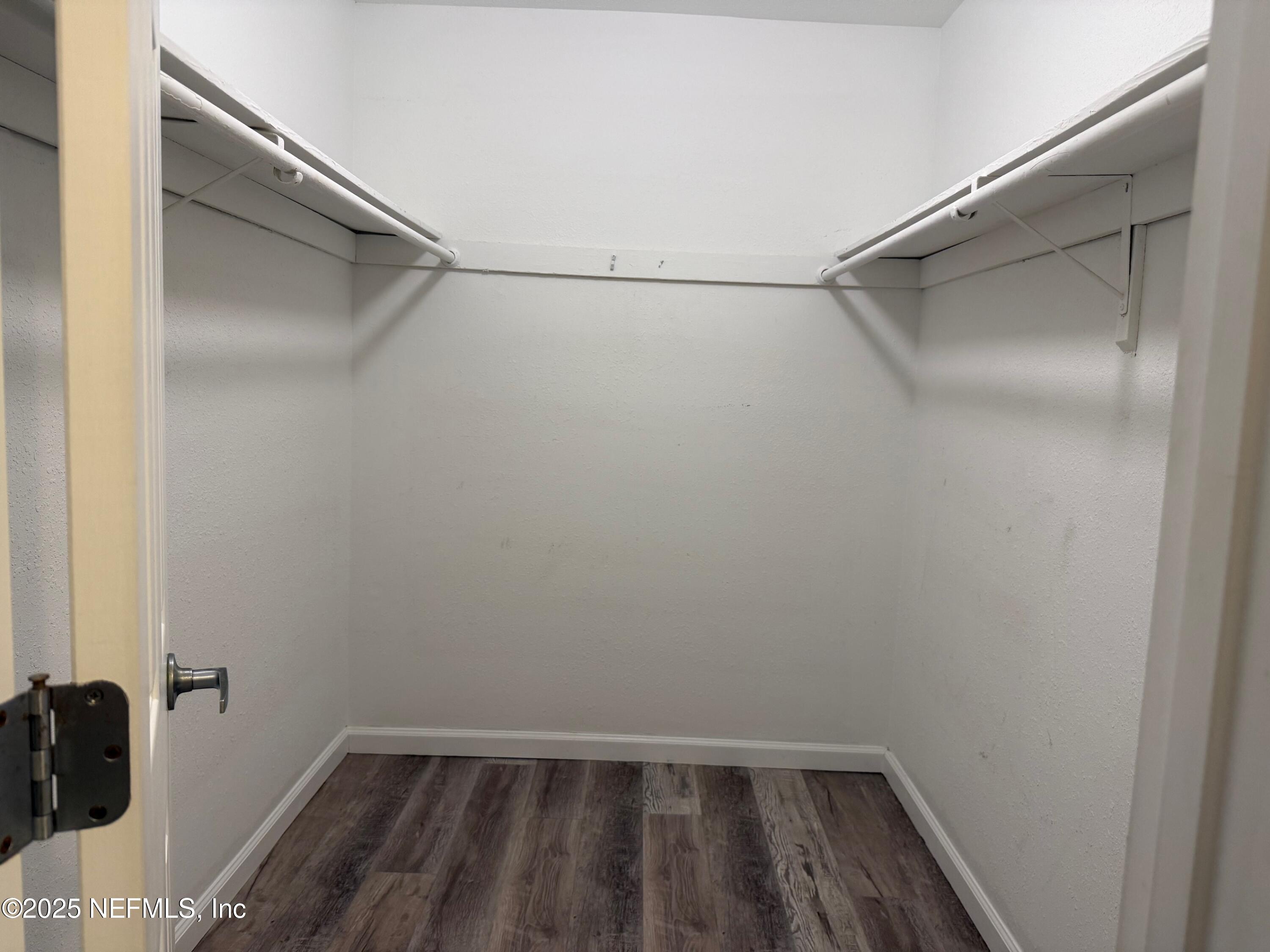 8880 Old Kings Road South, Unit 6 Jacksonville, FL 32257 - Photo 19 of 27 a view of walk in closet with empty racks