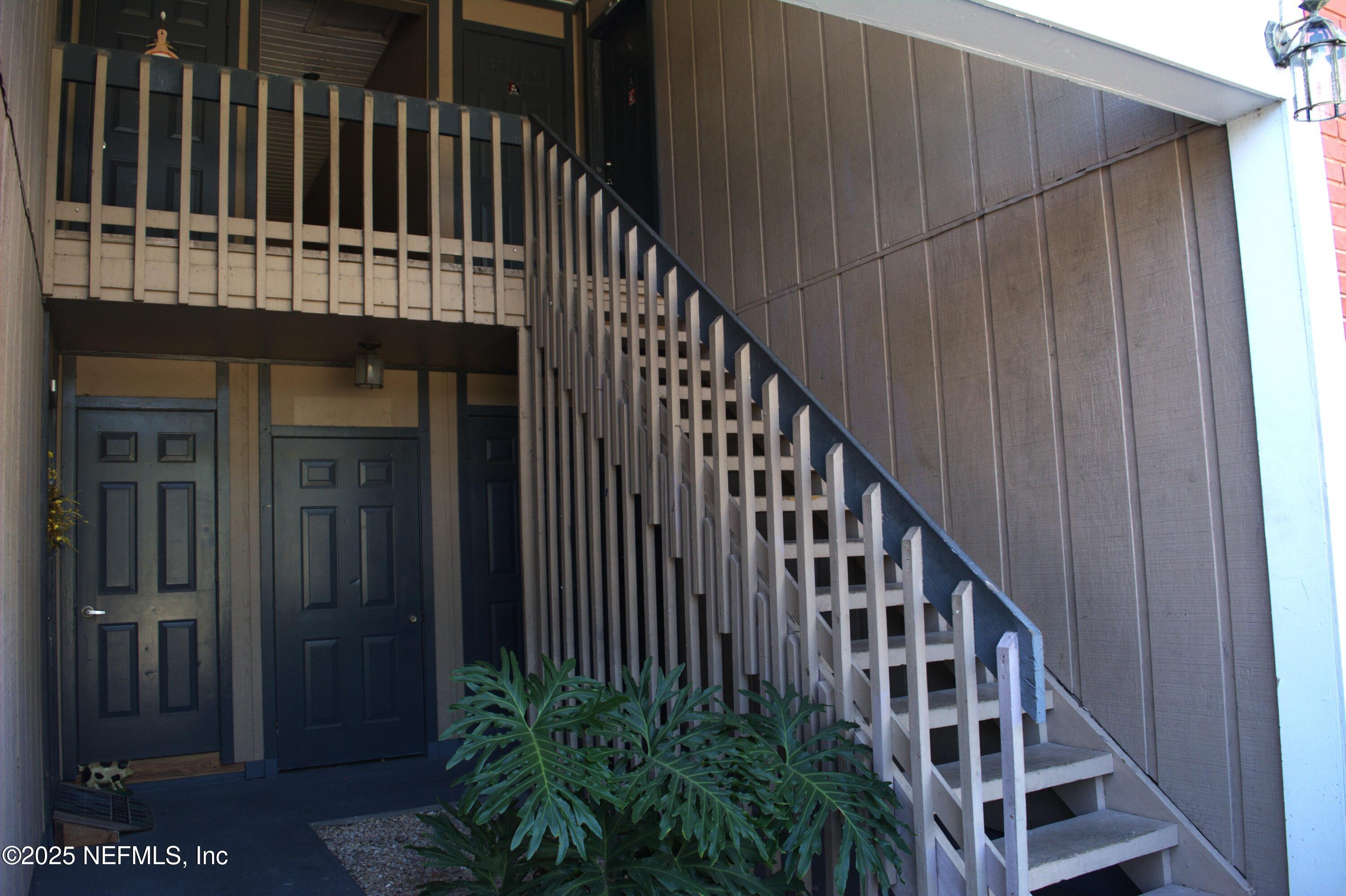 8880 Old Kings Road South, Unit 6 Jacksonville, FL 32257 - Photo 2 of 27 a view of balcony with wooden fence and plants