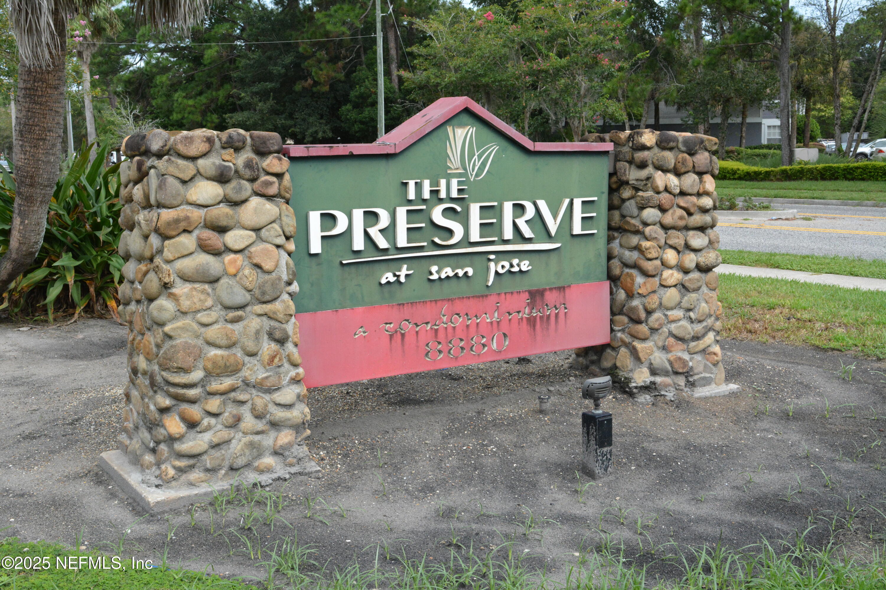 8880 Old Kings Road South, Unit 6 Jacksonville, FL 32257 - Photo 24 of 27 a sign that is sitting on a brick wall