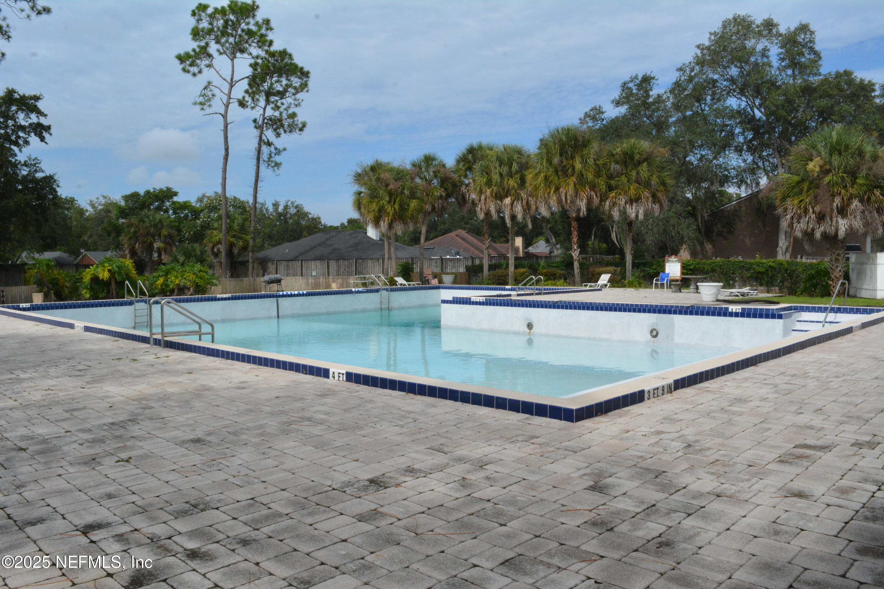 8880 Old Kings Road South, Unit 6 Jacksonville, FL 32257 - Photo 25 of 27 a view of a backyard space with palm trees