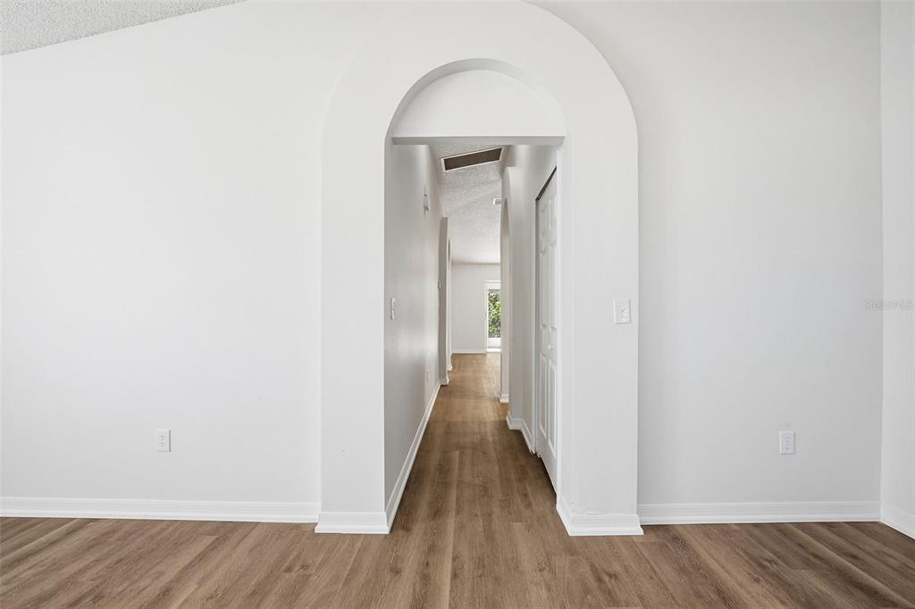 305 Abigail Road Plant City, FL 33563 - Photo 12 of 37 a view of a hallway with wooden floor