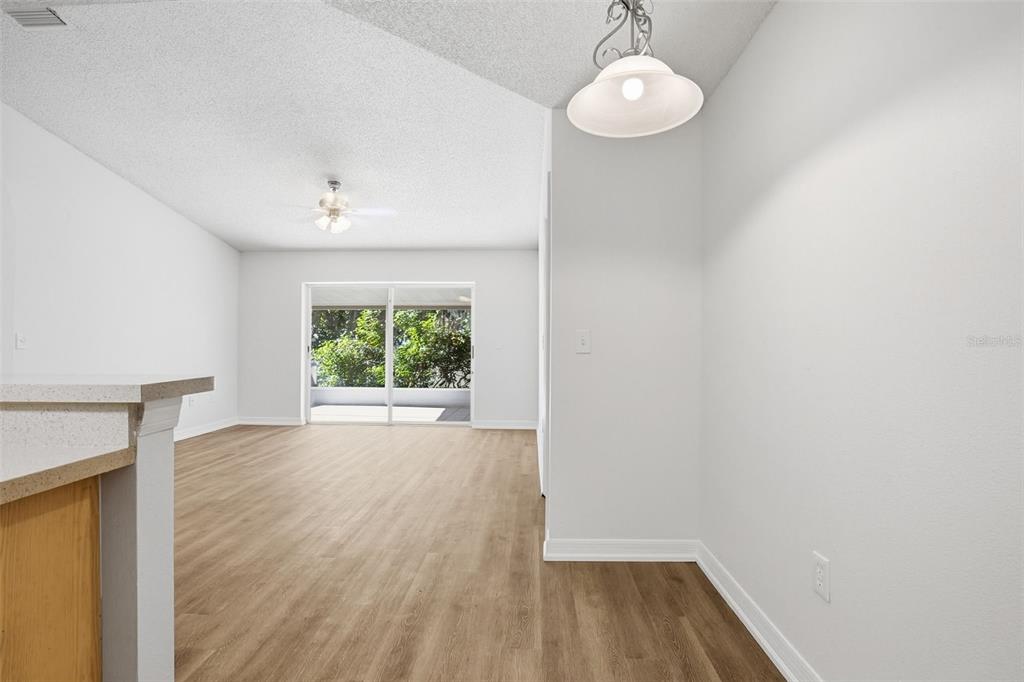 305 Abigail Road Plant City, FL 33563 - Photo 15 of 37 a view of empty room with wooden floor and fan