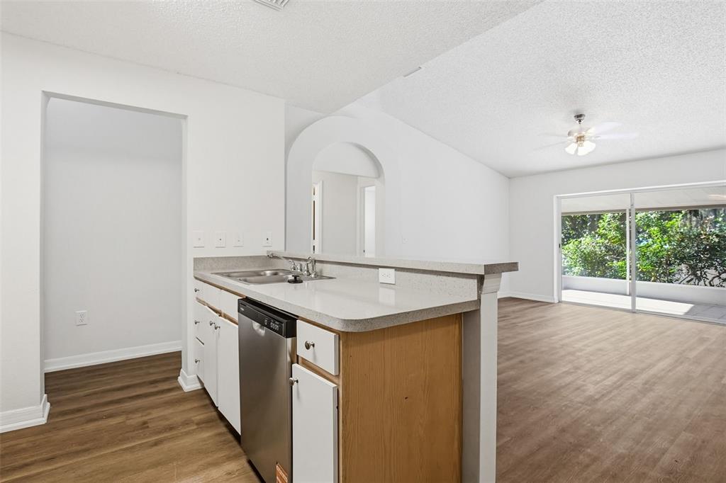 305 Abigail Road Plant City, FL 33563 - Photo 19 of 37 a view of a kitchen with a sink and wooden floor