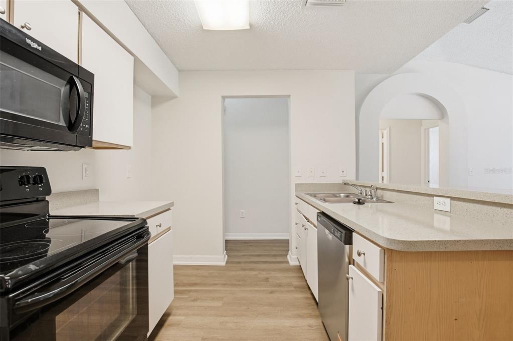 305 Abigail Road Plant City, FL 33563 - Photo 20 of 37 a kitchen with stainless steel appliances granite countertop a sink and a stove