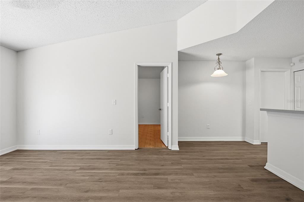 305 Abigail Road Plant City, FL 33563 - Photo 21 of 37 a view of an empty room with wooden floor and a window