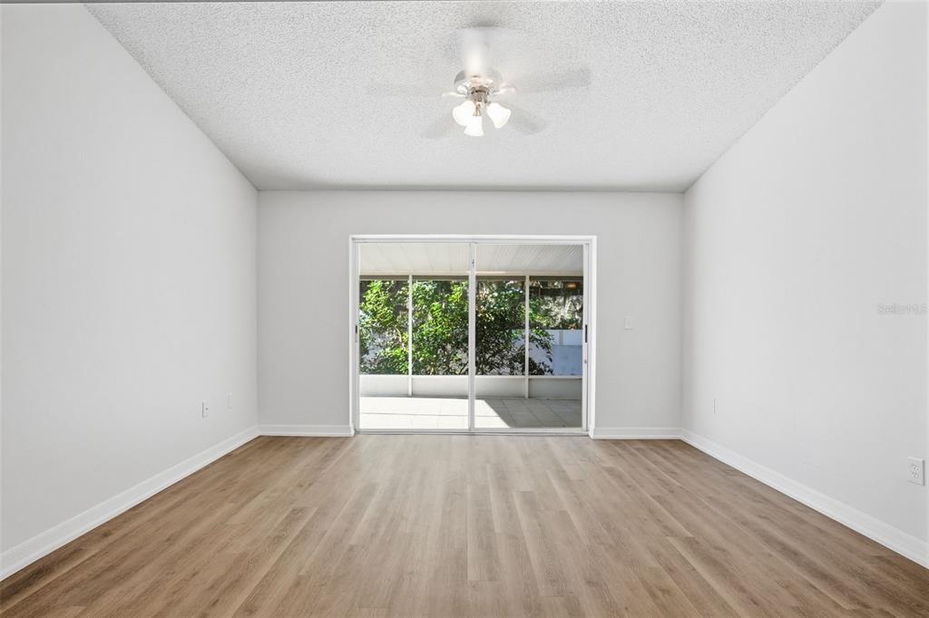 305 Abigail Road Plant City, FL 33563 - Photo 33 of 37 an empty room with wooden floor and windows