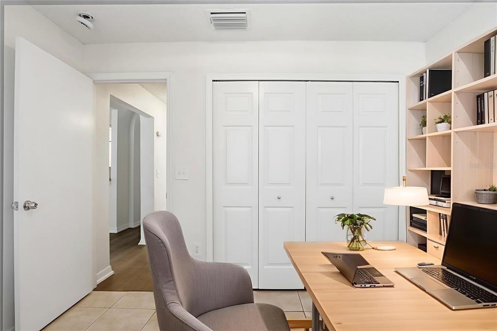 305 Abigail Road Plant City, FL 33563 - Photo 4 of 37 a living room with furniture a flat screen tv and a refrigerator