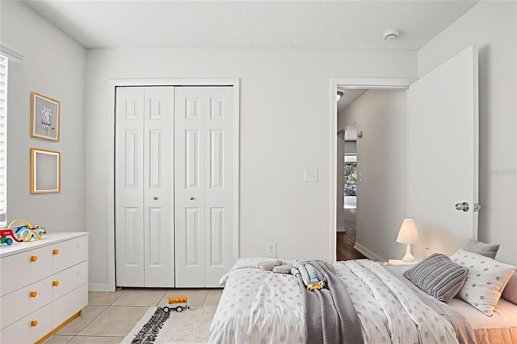 305 Abigail Road Plant City, FL 33563 - Photo 5 of 37 a bedroom with a bed and a dresser