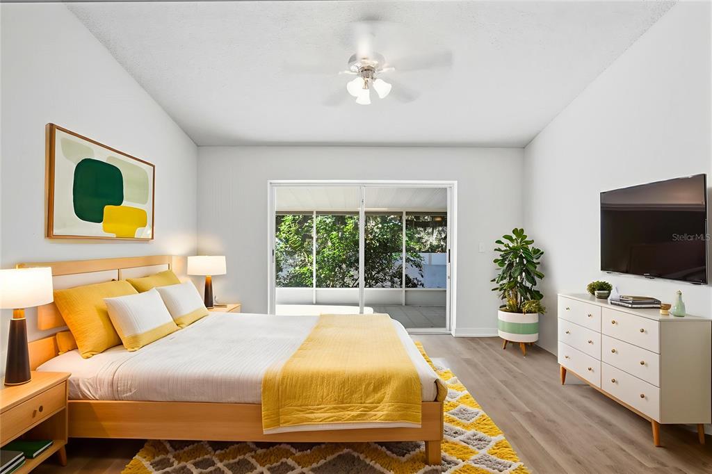 305 Abigail Road Plant City, FL 33563 - Photo 6 of 37 a bedroom with a bed and a flat screen tv