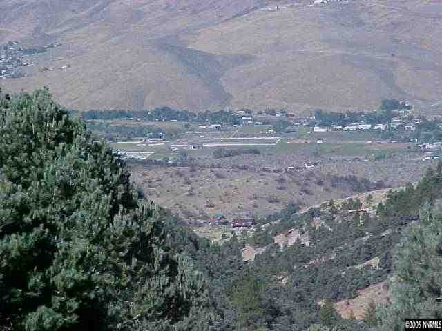 1 Toll Road Reno, NV 89521 - Photo 1 of 2 a view of dirt field with large trees
