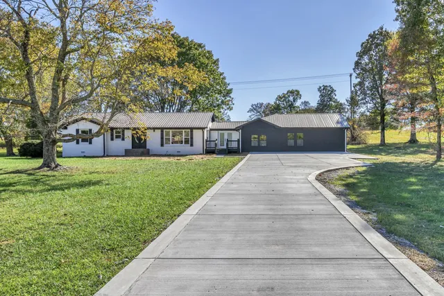 a view of empty room with wooden floor and cabinet