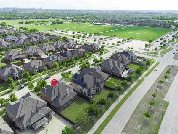 an aerial view of a house with yard swimming pool and outdoor seating