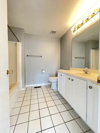 a bathroom with a sink a mirror and a shower