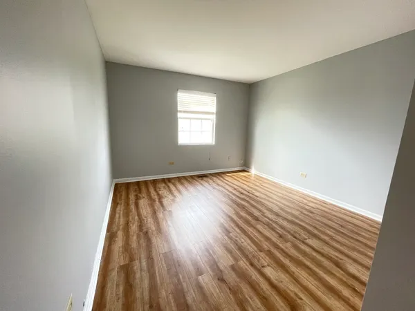 wooden floor in a hall with an entryway