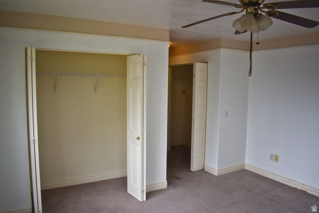 3327 East Windhover Road Eagle Mountain, UT 84005 - Photo 15 of 38 Bedroom featuring carpeting, white walls, and a ceiling fan with light fixture