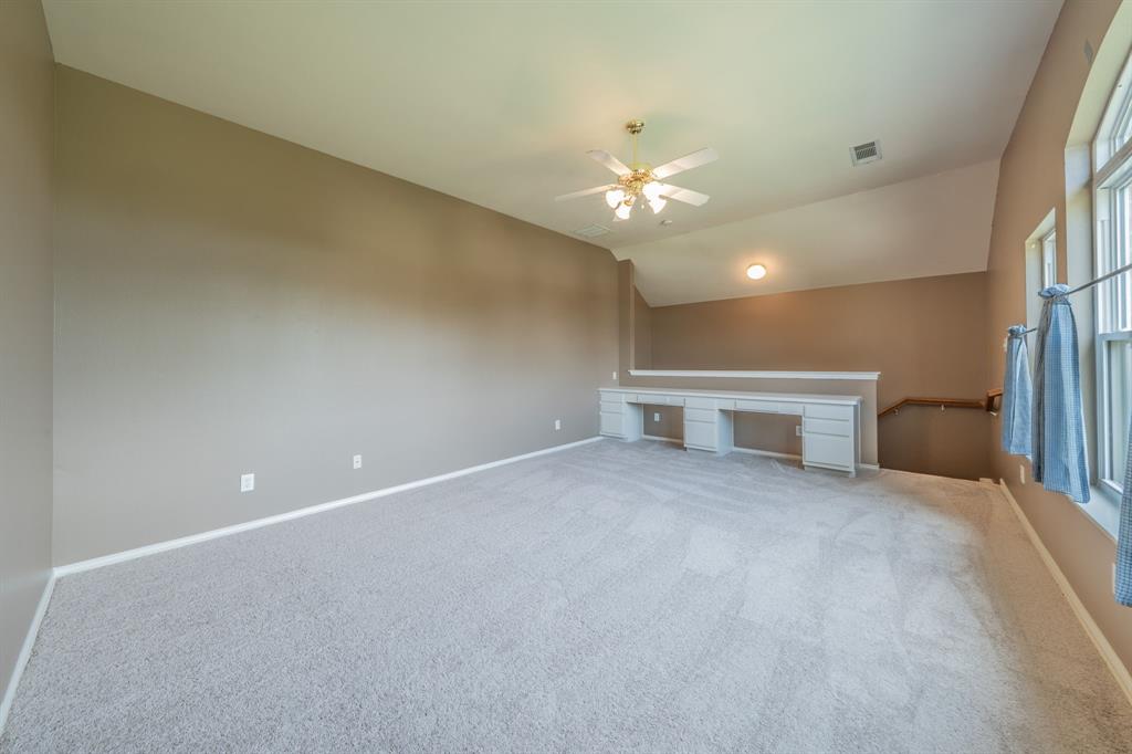 7517 Rodeo Drive Denton, TX 76208 - Photo 28 of 39 Two built-in desk areas are located in the game room