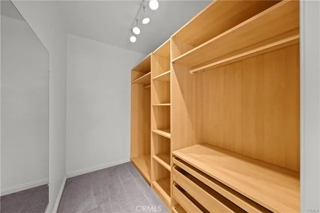 a room with wooden floor and white walls