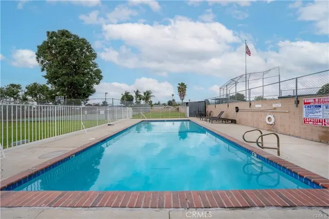 a view of a swimming pool with a sitting area