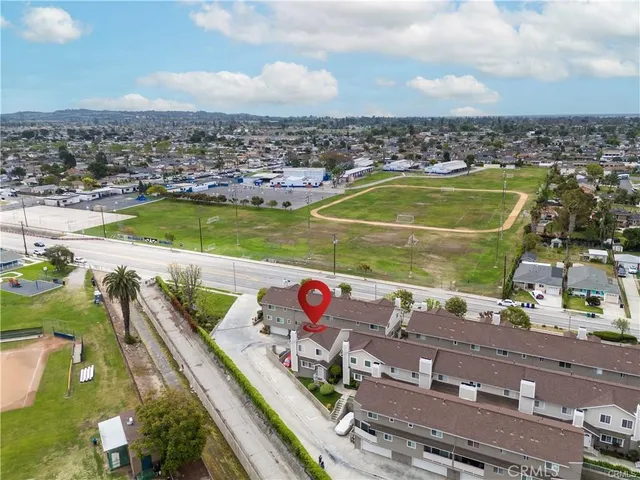 an aerial view of residential houses with outdoor space