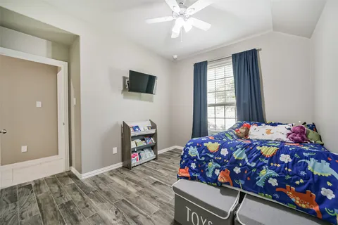 a bedroom with bed and a window