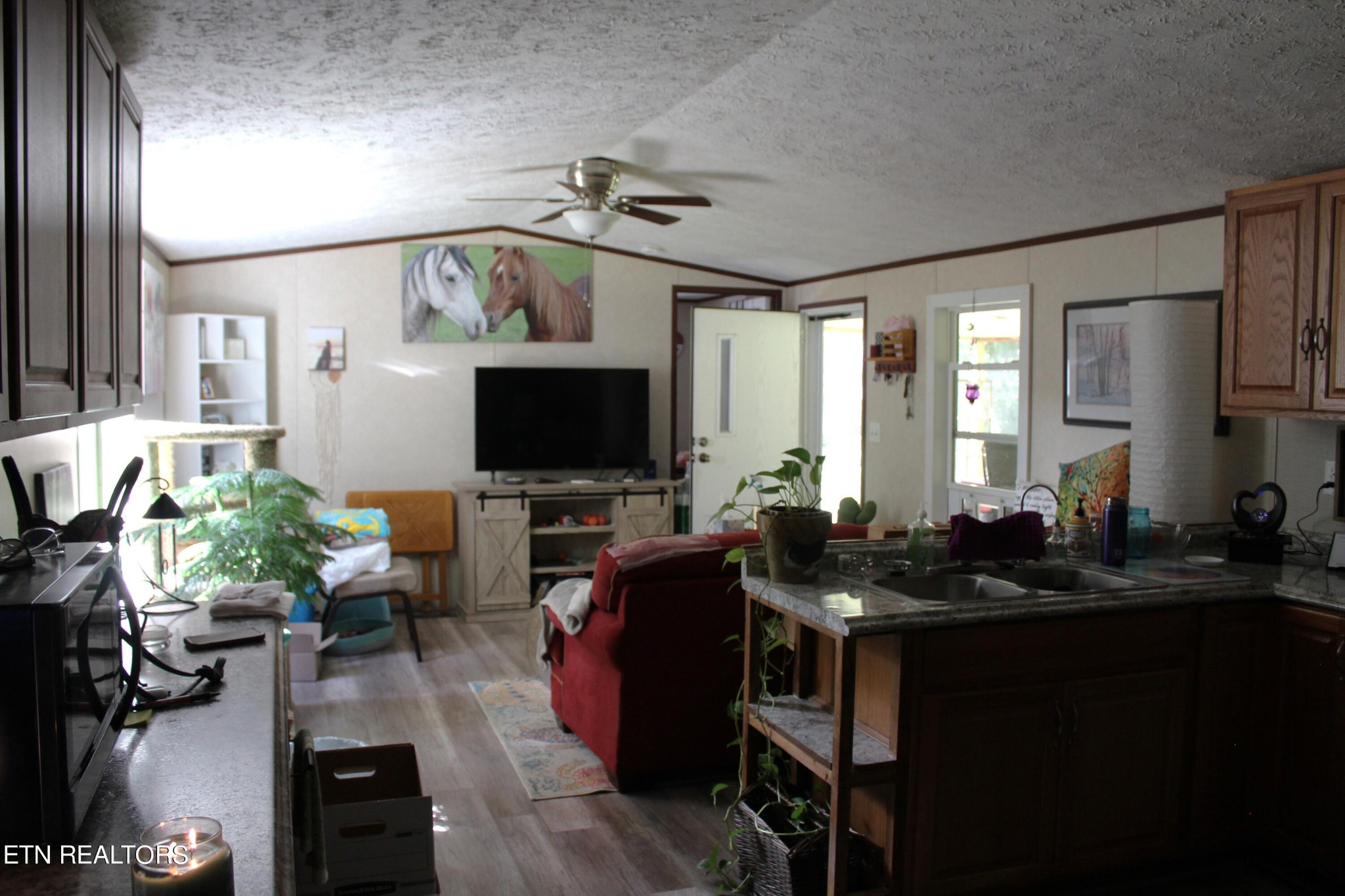 340 Brakebill Road Vonore, TN 37885 - Photo 12 of 33 a living room with furniture and a flat screen tv