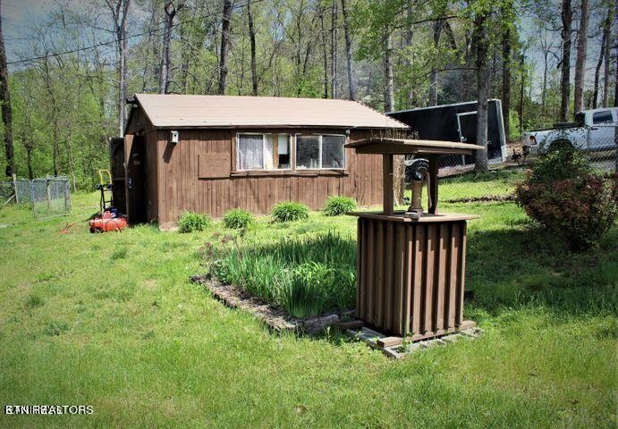 340 Brakebill Road Vonore, TN 37885 - Photo 19 of 33 a front view of a house with garden