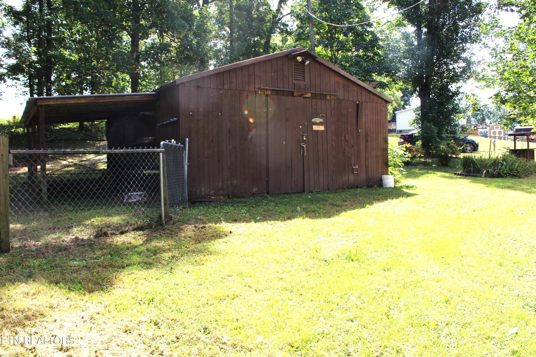 340 Brakebill Road Vonore, TN 37885 - Photo 20 of 33 a backyard of a house with lots of green space