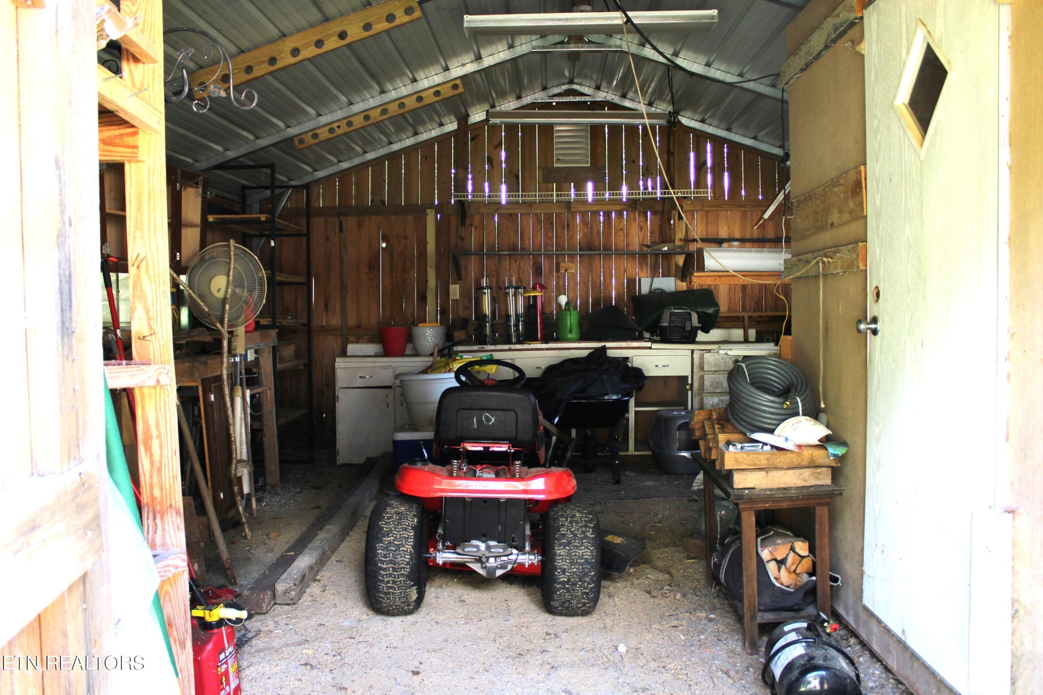 340 Brakebill Road Vonore, TN 37885 - Photo 21 of 33 a store room with furniture and a fireplace