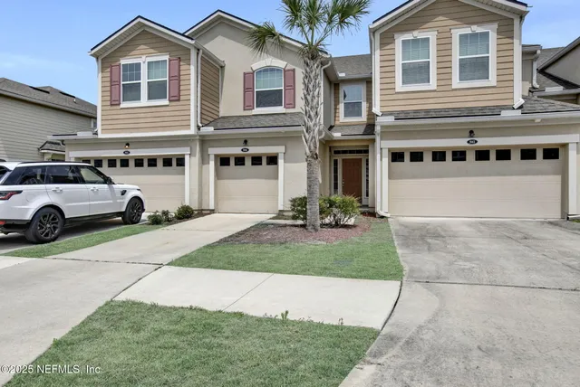 a view of a car parked in front of a house