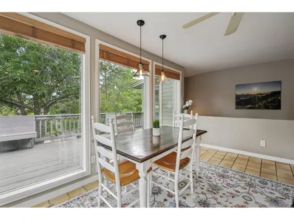 a living room with a table and a large window