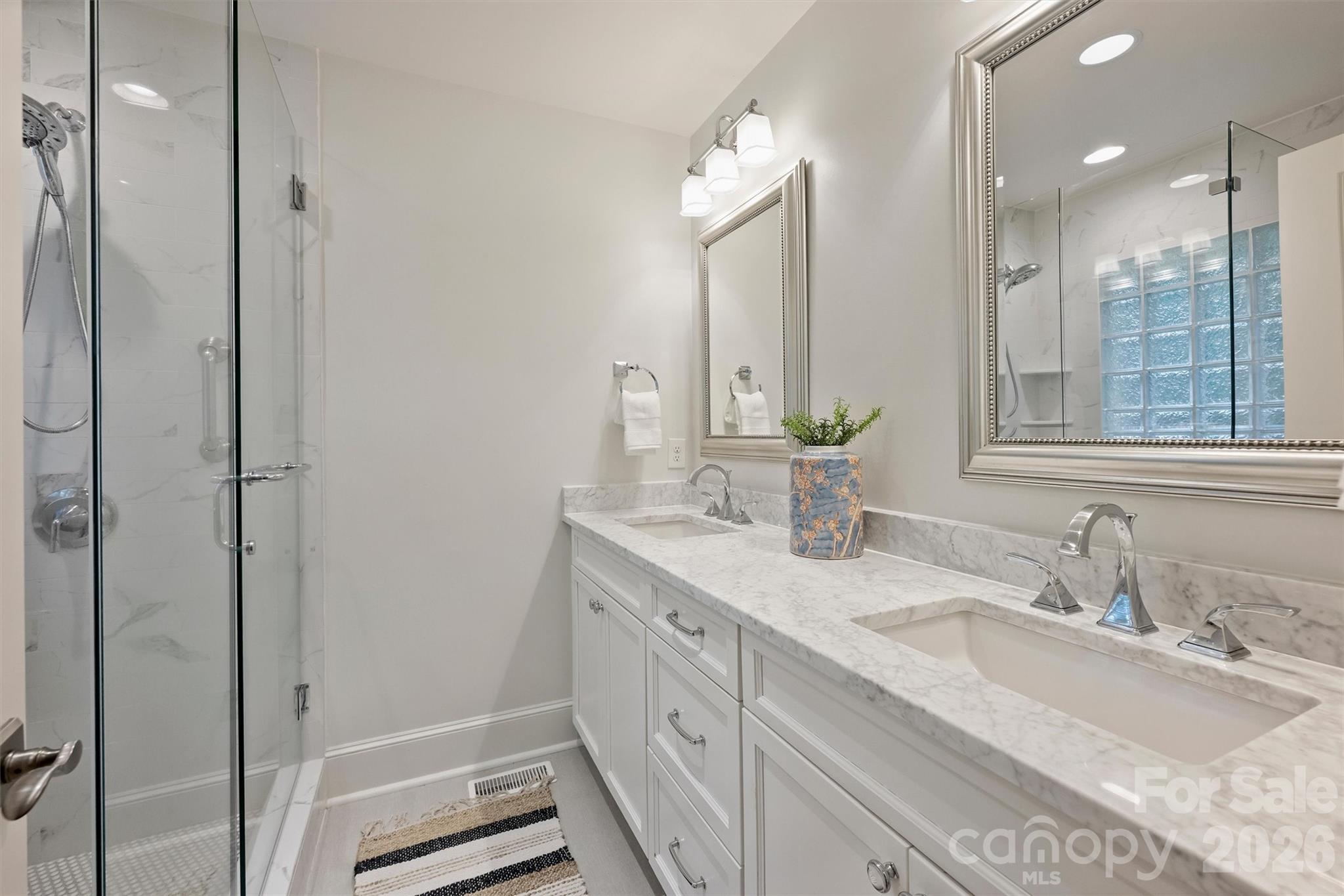 5519 Robinhood Road Charlotte, NC 28211 - Photo 32 of 46 a bathroom with a double vanity sink mirror and double