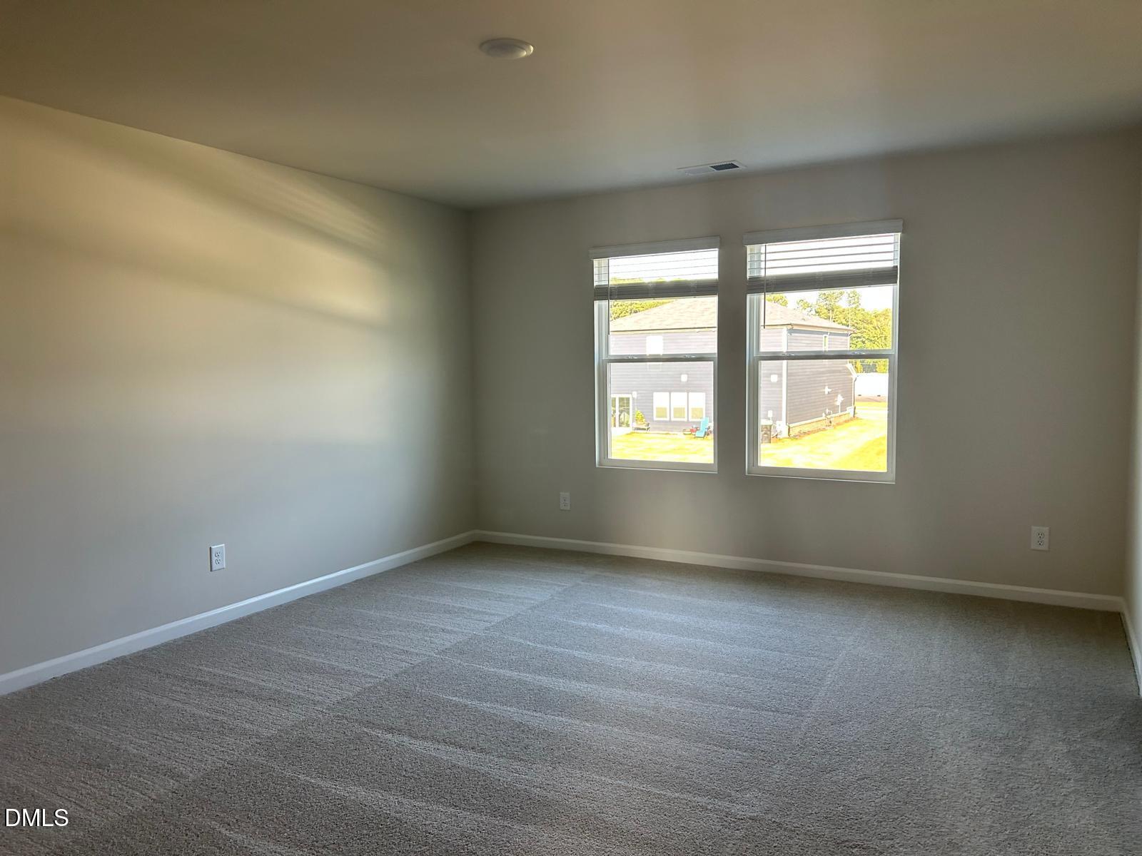 1220 Whitespire Way Zebulon, NC 27597 - Photo 11 of 20 an empty room with a window