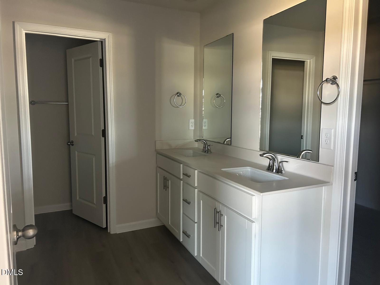 1220 Whitespire Way Zebulon, NC 27597 - Photo 15 of 20 a bathroom with 2 sink and a mirror