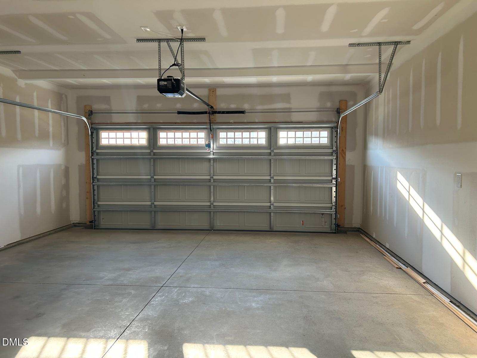 1220 Whitespire Way Zebulon, NC 27597 - Photo 18 of 20 a view of a garage room