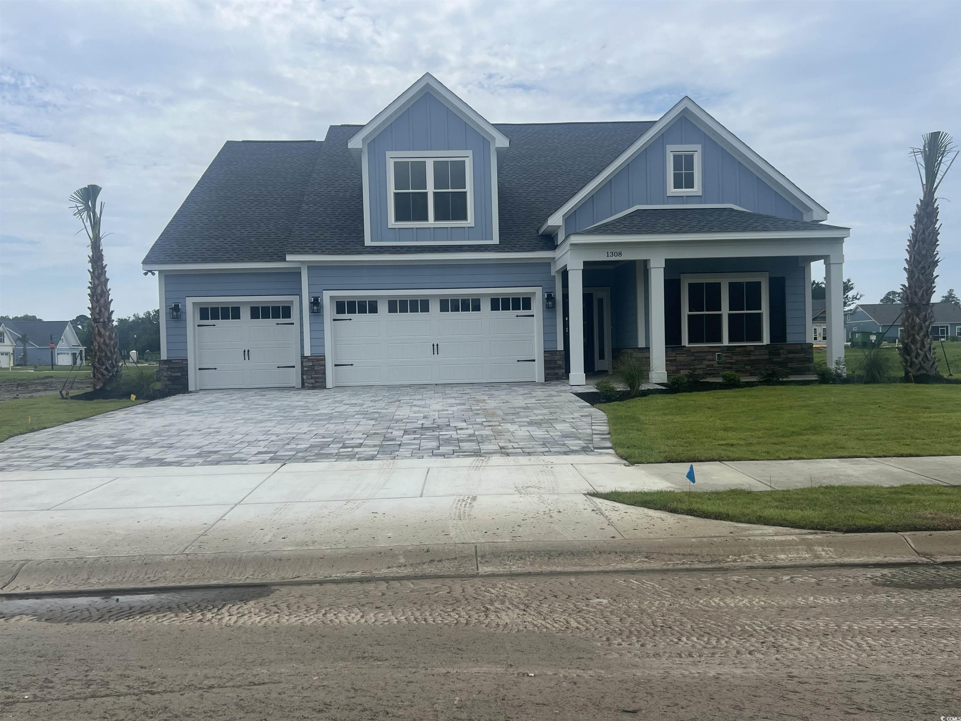 1308 Crooked Hook Road North Myrtle Beach, SC 29582 - Photo 1 of 23 Craftsman inspired home with a shingled roof, ston