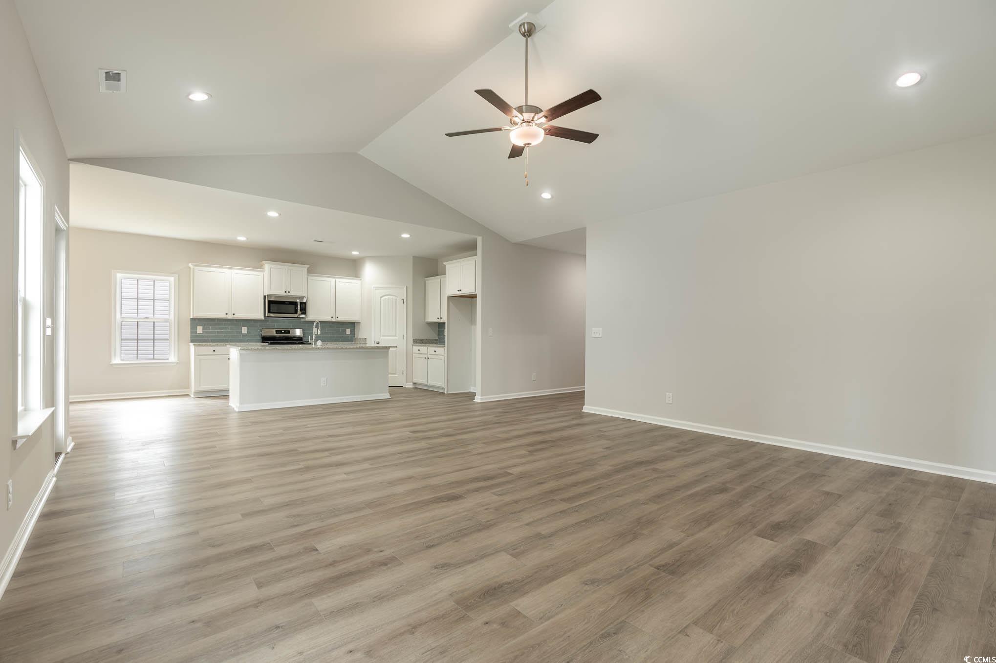 1308 Crooked Hook Road North Myrtle Beach, SC 29582 - Photo 16 of 23 Unfurnished living room featuring light wood-type
