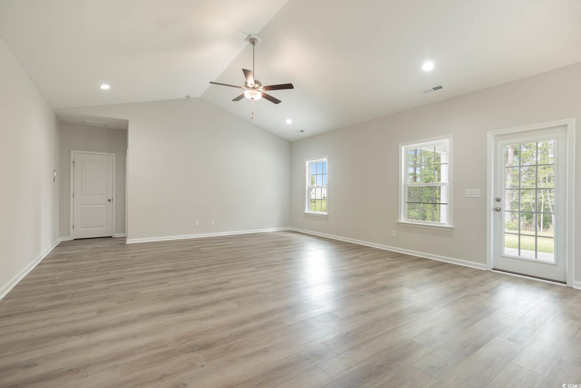 1308 Crooked Hook Road North Myrtle Beach, SC 29582 - Photo 18 of 23 Unfurnished living room featuring ceiling fan, lig