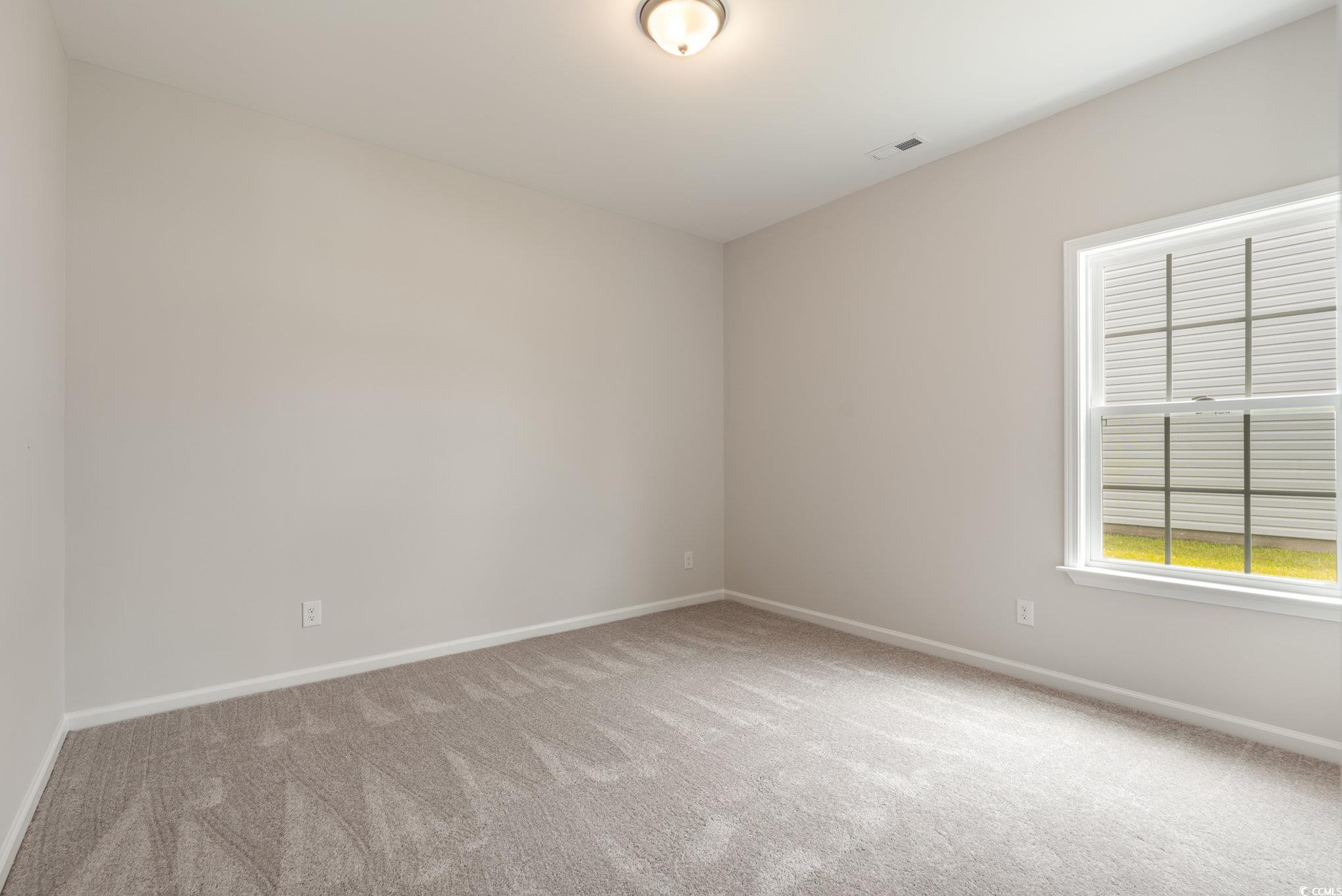 1308 Crooked Hook Road North Myrtle Beach, SC 29582 - Photo 3 of 23 View of carpeted spare room